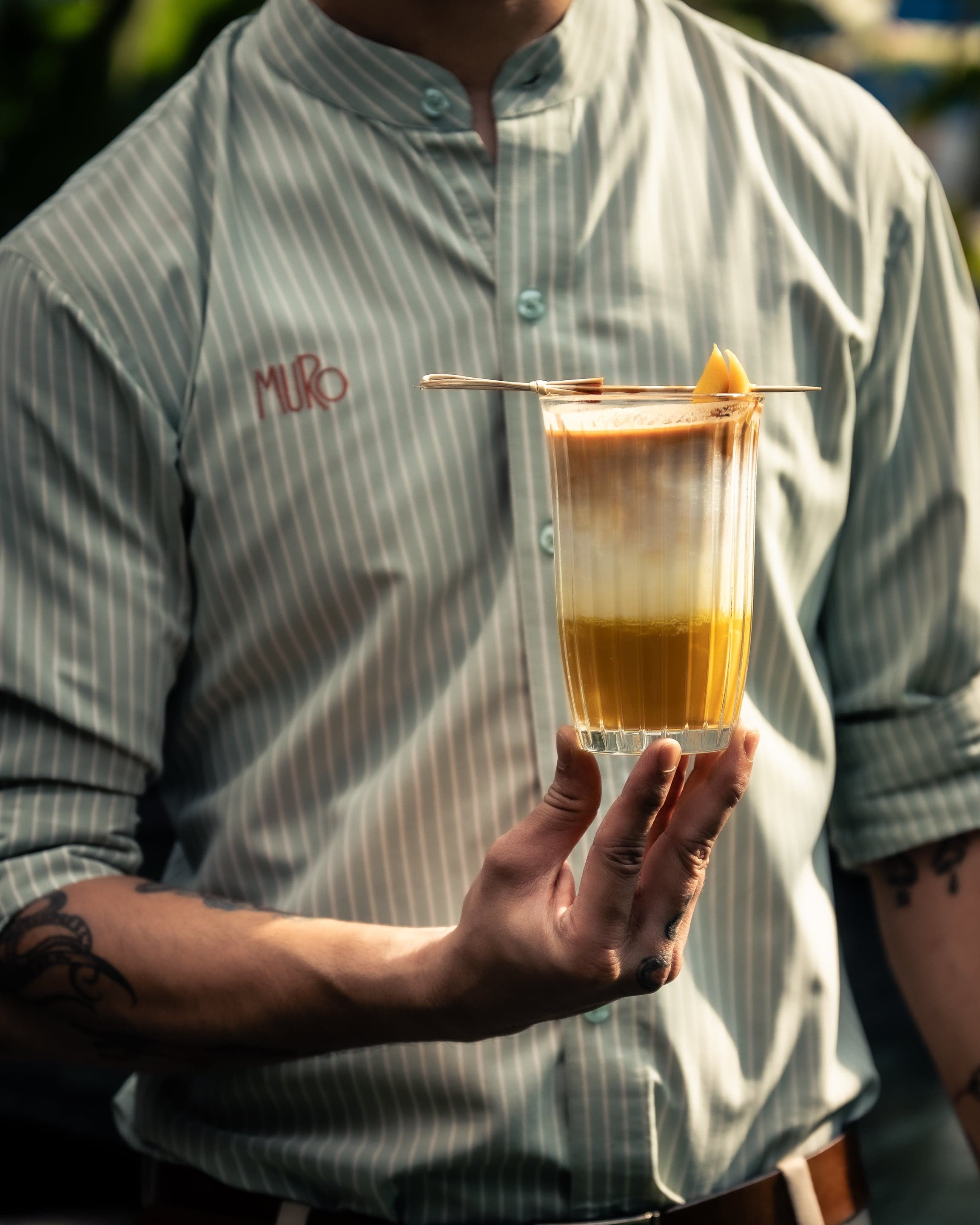 A crystal-cut tumbler with a signature MURO cocktail
